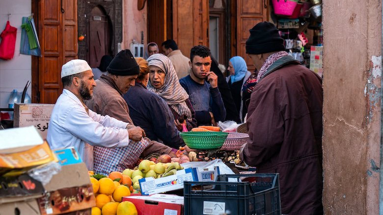 People shop for food at a market in medina (downtown) of Marrakech..