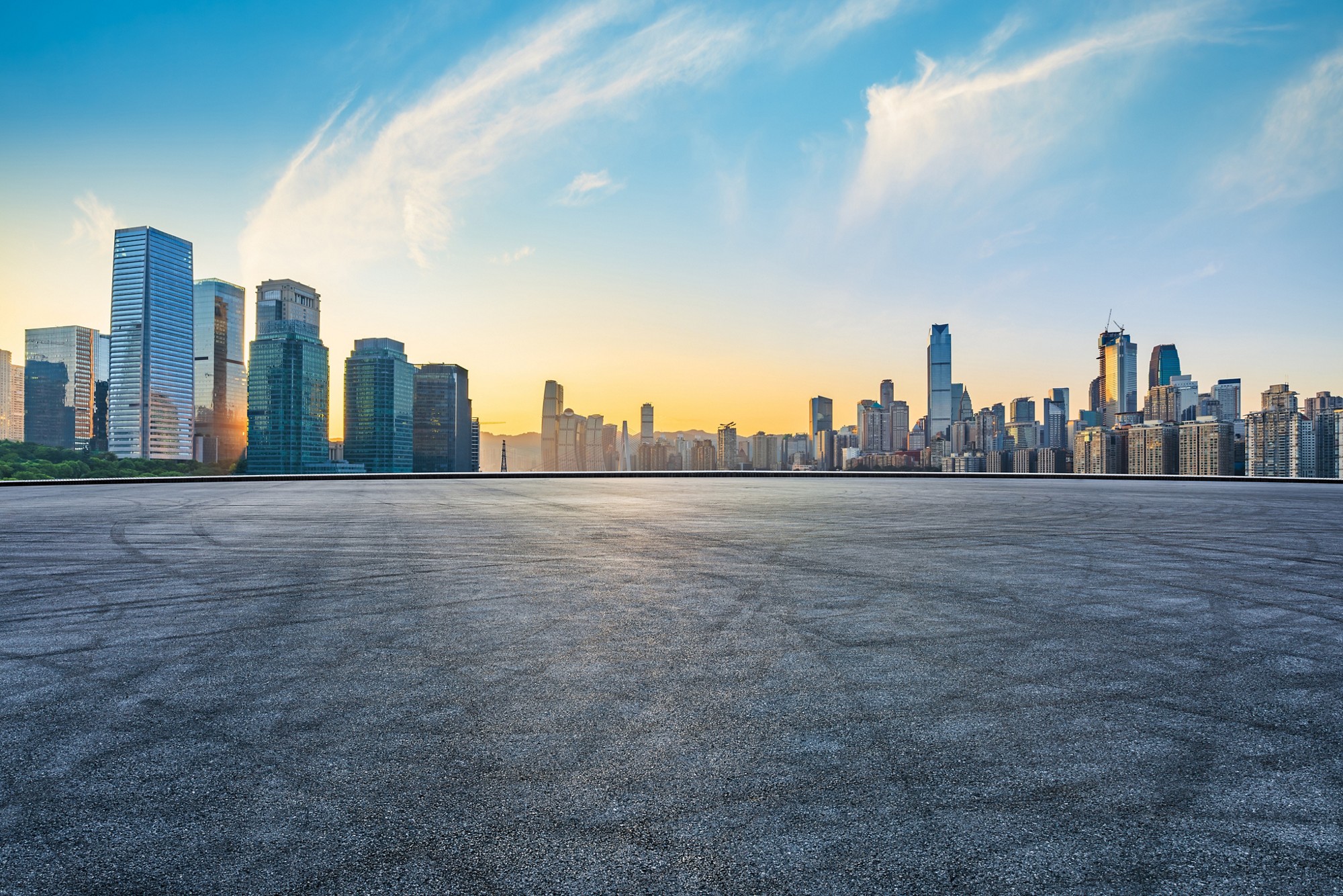 Asphalt road square and city skyline with modern buildings scenery at sunrise in Chongqing