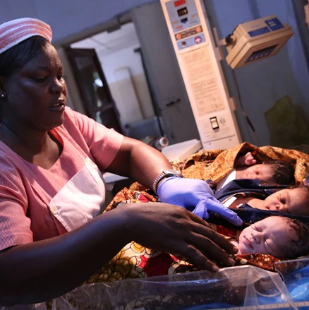 Fatmata Bamorie Turay (far left) and Elizabeth Tumoe, registered nurses look after newborns at the Princess Christian Maternity Hospital, in Freetown Sierra Leone on June 18, 2015. Photo © Dominic Chavez/World Bank