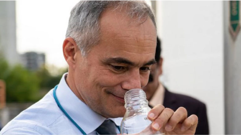 Nico Saporiti of the IFC smells tertiary-treated wastewater now safe to drink at the Beirolas Water Factory in Portugal