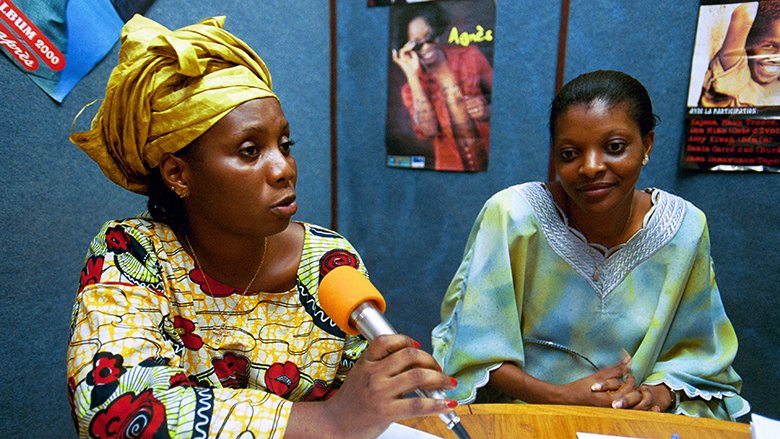 Women refugees at local radio station speaking about the problems they face